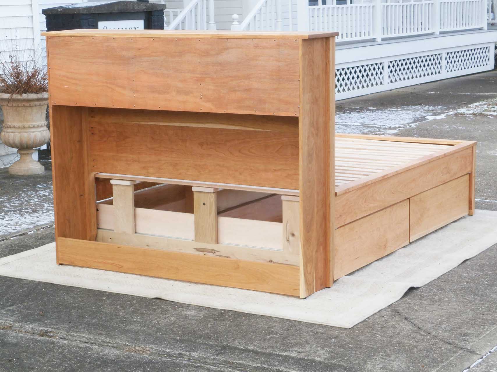 back of platform bed with bookcase headboard and 4 drawers