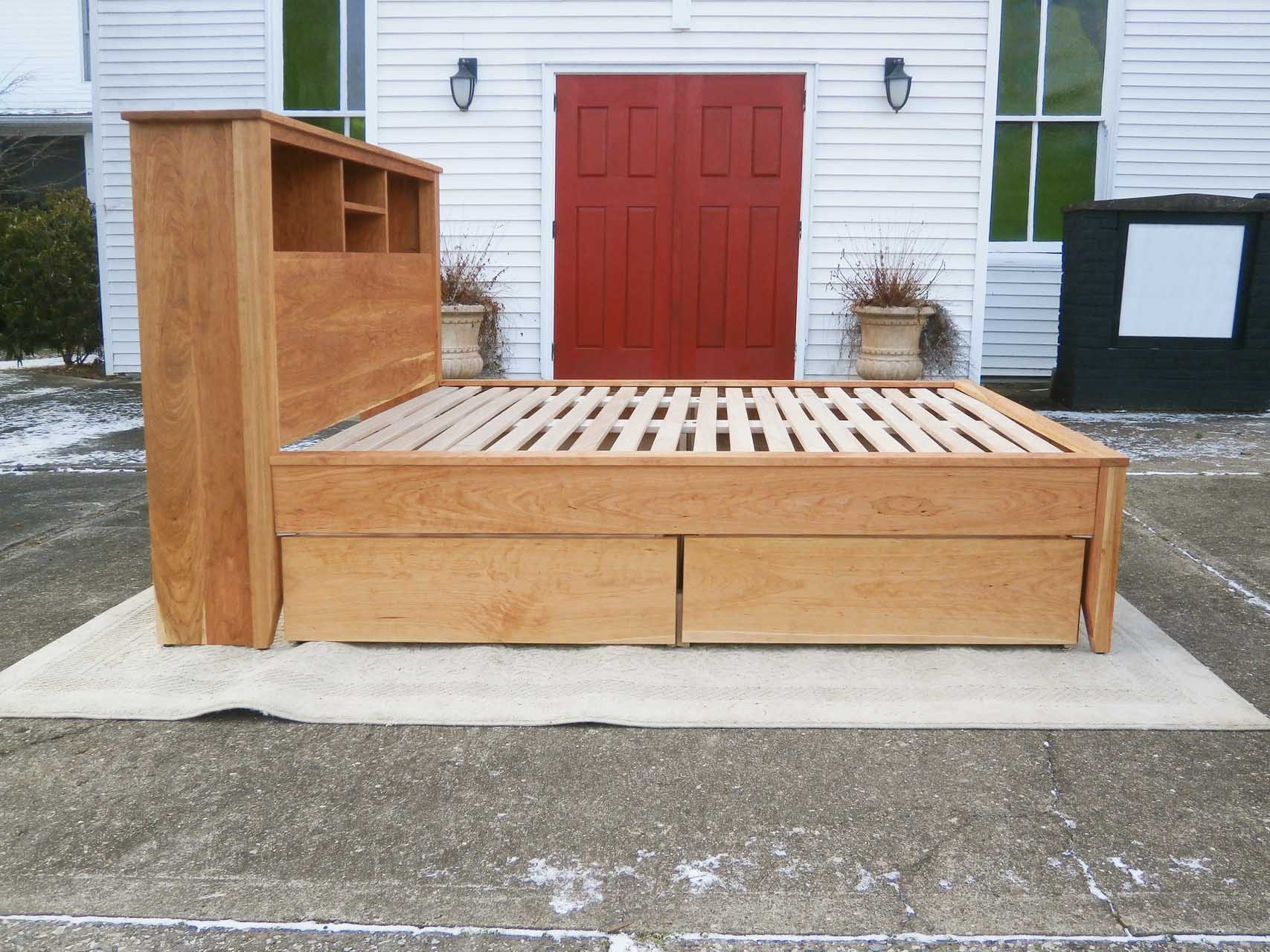 side of platform bed with bookcase headboard and 4 drawers