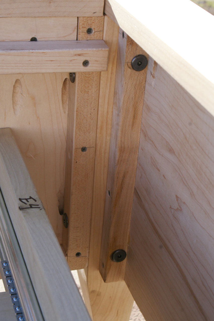 corner joint of Platform Bed with 4 drawers and tapered feet