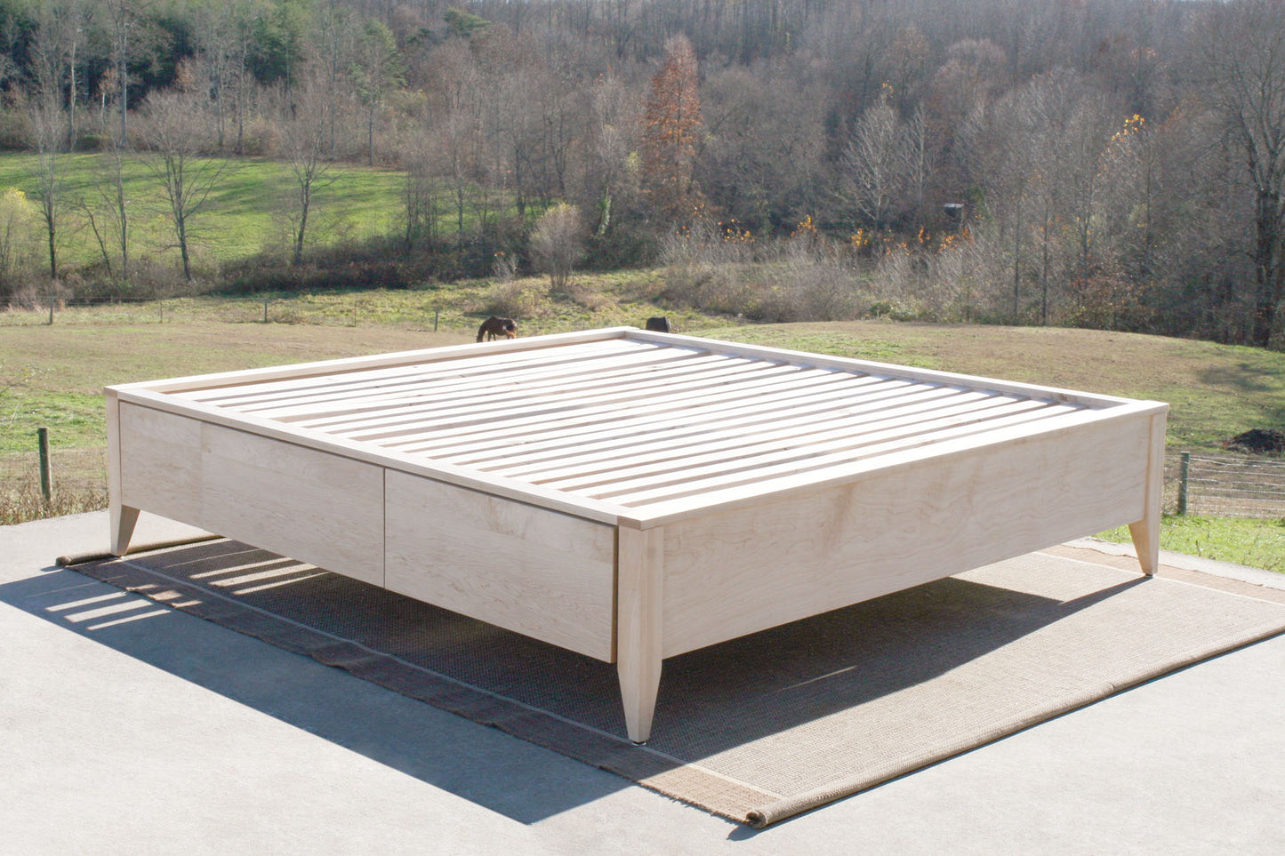 angled view Platform Bed with 4 drawers and tapered feet