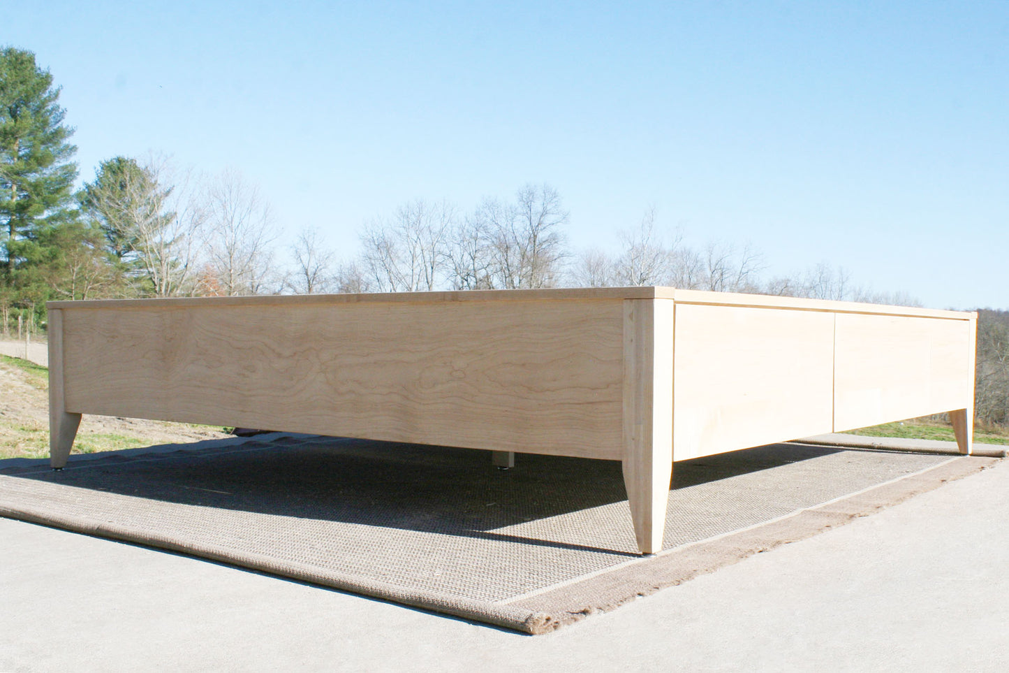 low angled view Platform Bed with 4 drawers and tapered feet