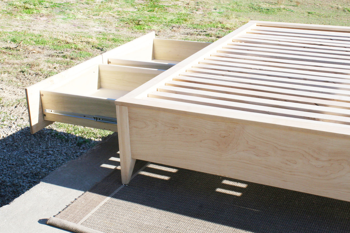 Platform Bed with 4 drawers and tapered feet two drawers open