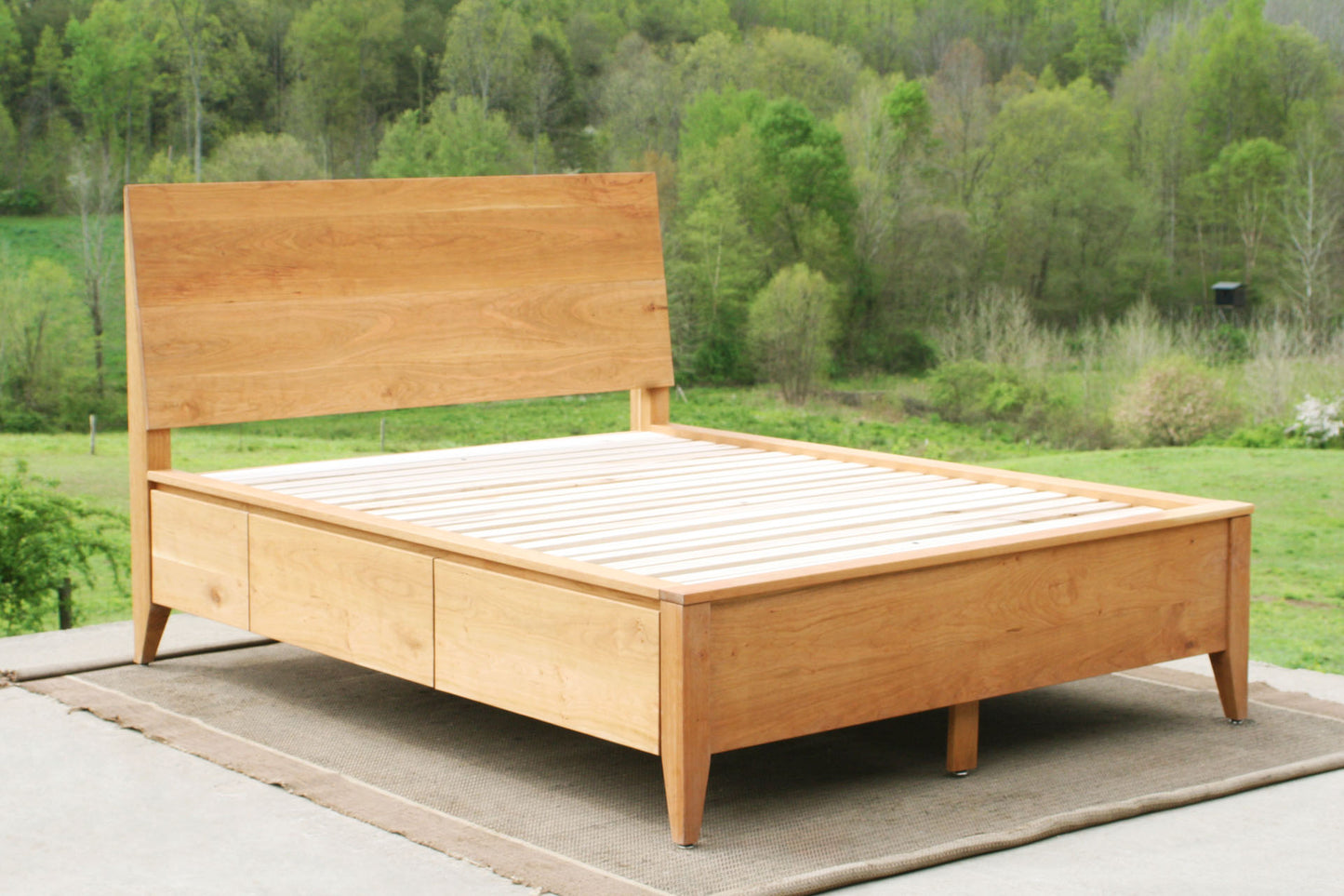 angled view solid custom Platform storage bed with headboard