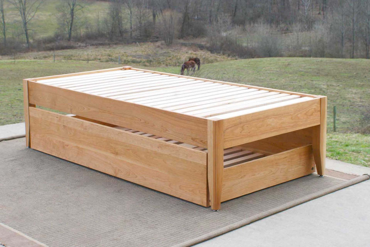 angled view natural hardwood Simply Elegant Platform Bed with Trundle