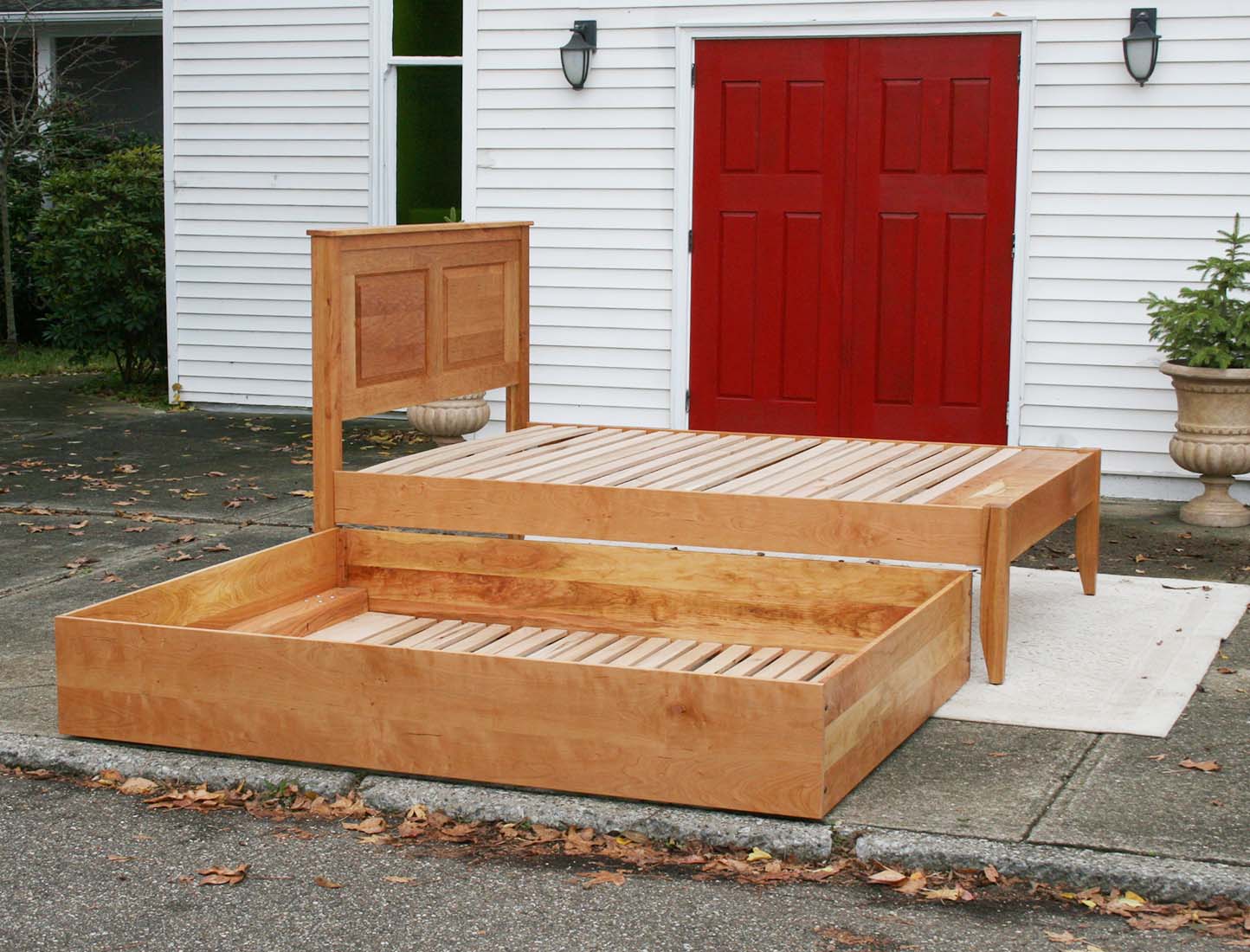 side view trundle out Roll out Trundle Bed with paneled headboard
