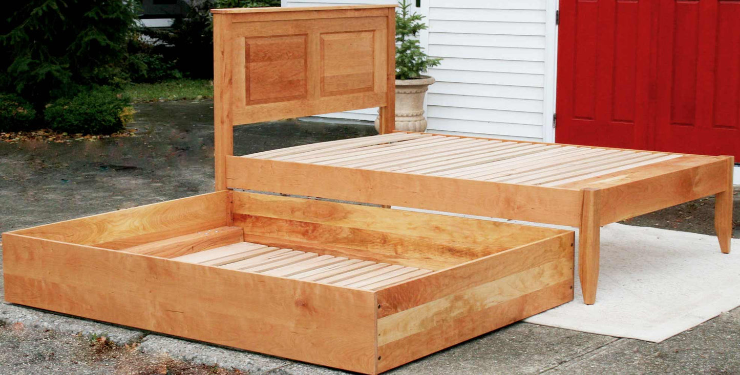 Roll out Trundle Bed with paneled headboard angled view