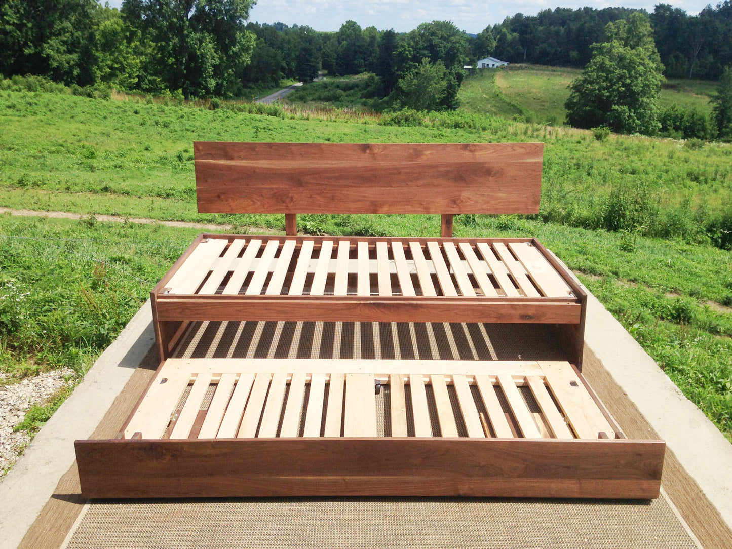walnut daybed with pop up trundle half extended front view