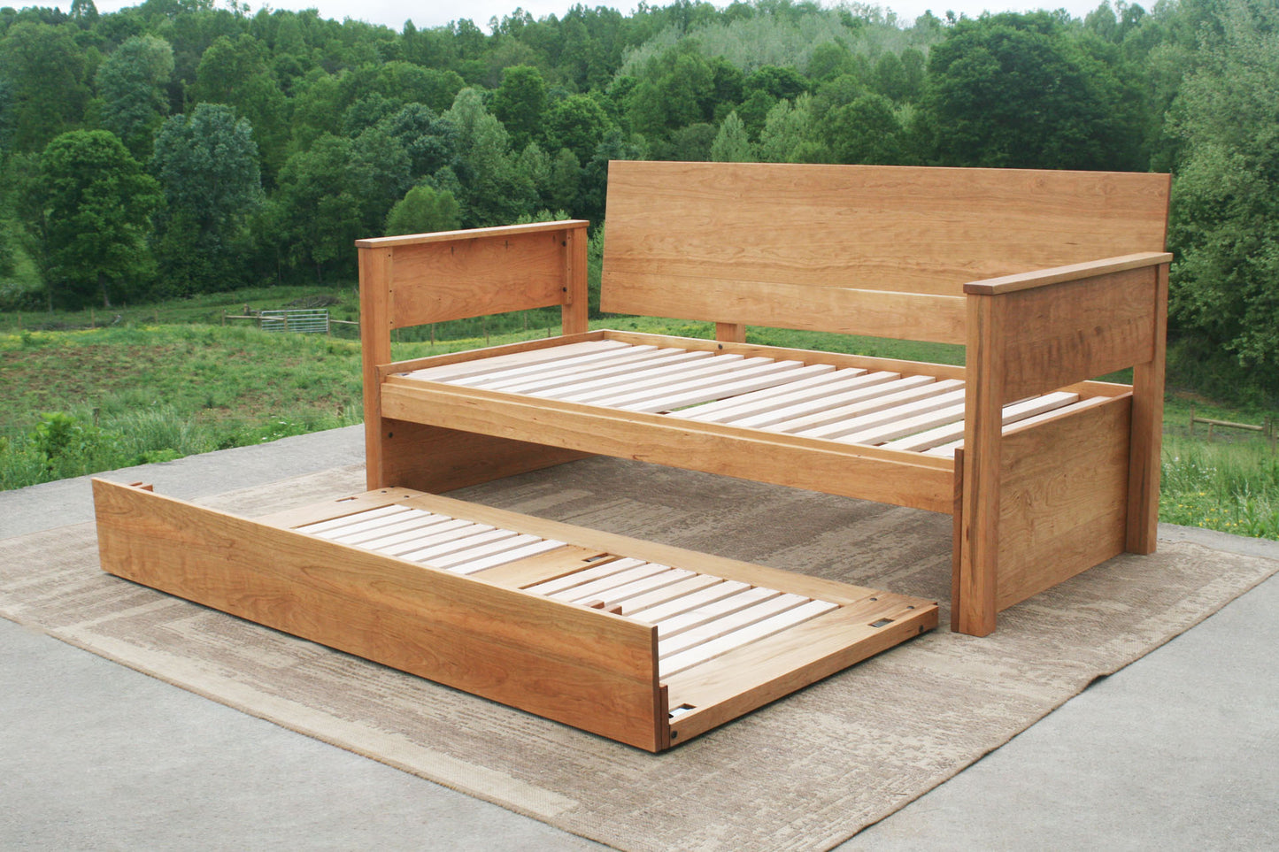 Daybed with trundle, backboard and armrests with trundle out but not up