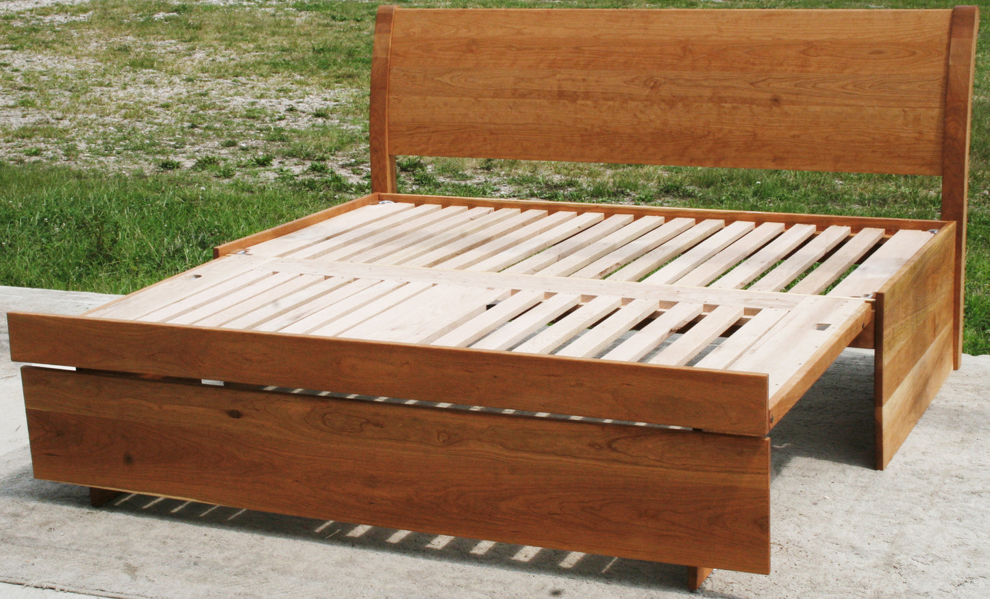 angled view three function pop up trundle bed with sleigh backboard