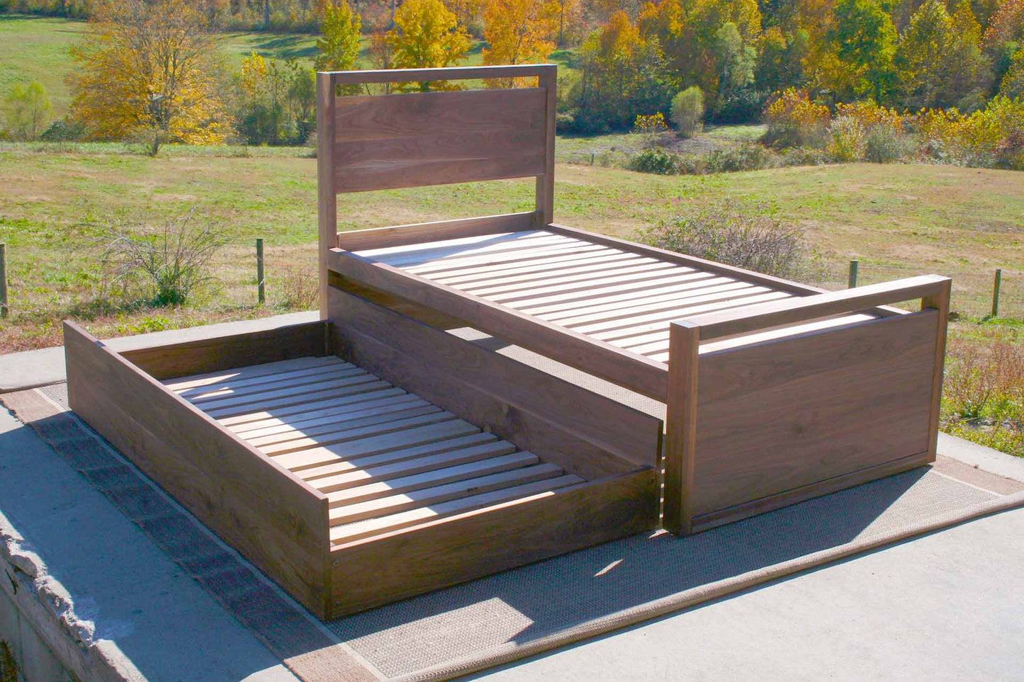angled view Trundle Bed with top rails on headboard and footboard angled view