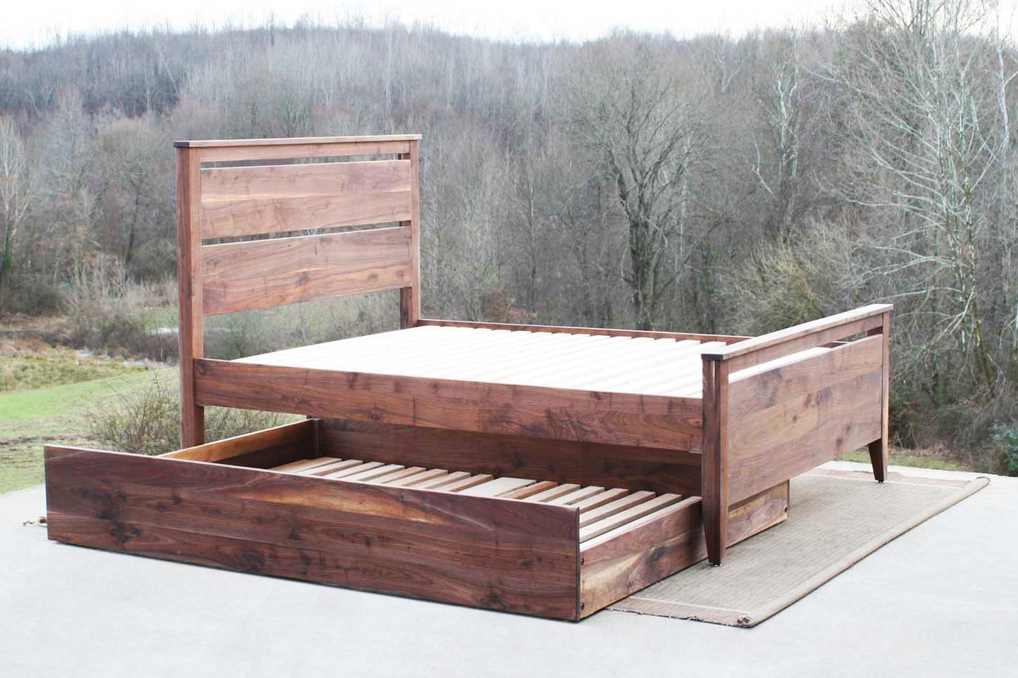 side view walnut Trundle Bed with headboard and footboard trundle partly out