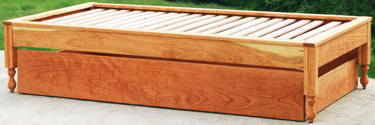 close up angled view Trundle bed with platform top cap trim
