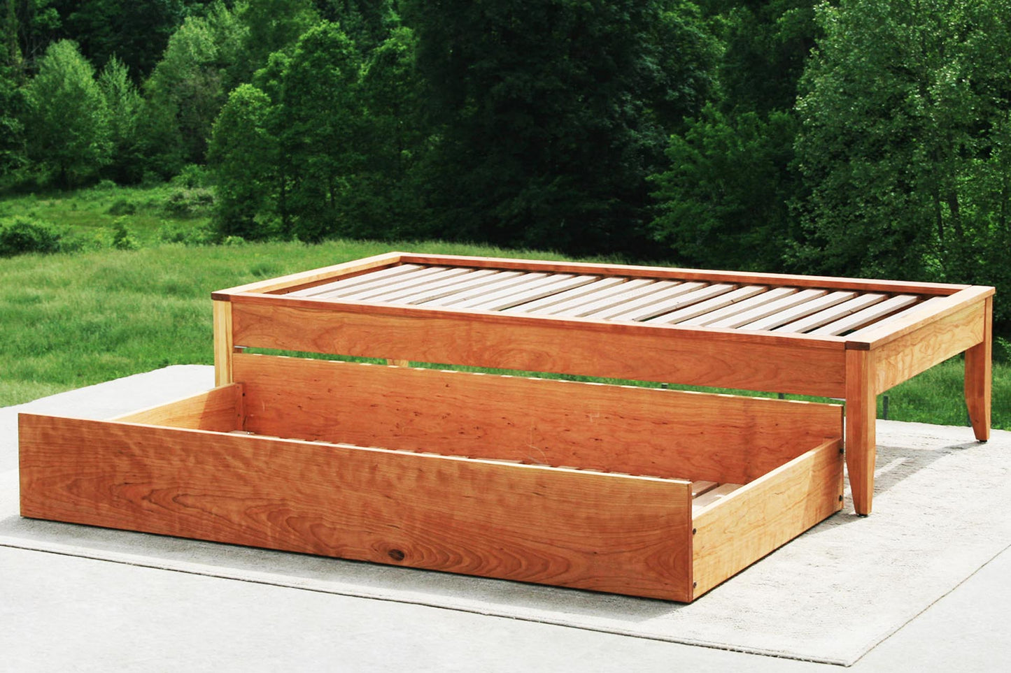 Trundle bed with platform top cap trim side view