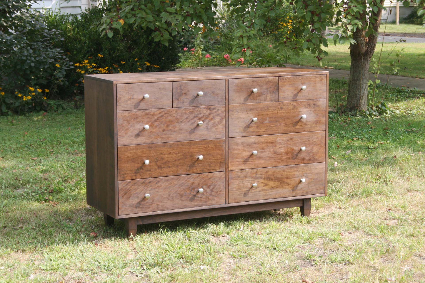 front angled view walnut 10 drawer dresser side view natural
