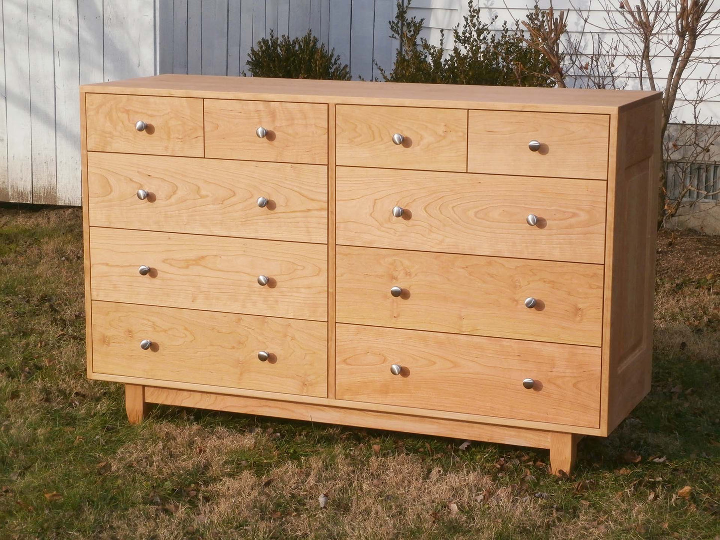 solid hardwood custom dresser with metal pulls front angled view