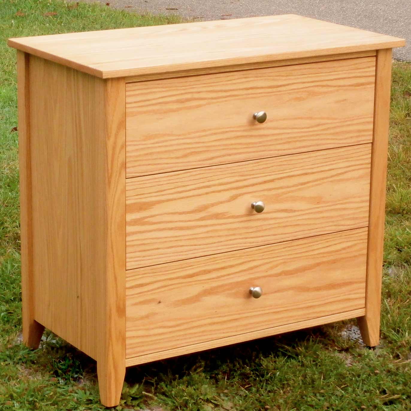 three drawer dresser hardwood angled view