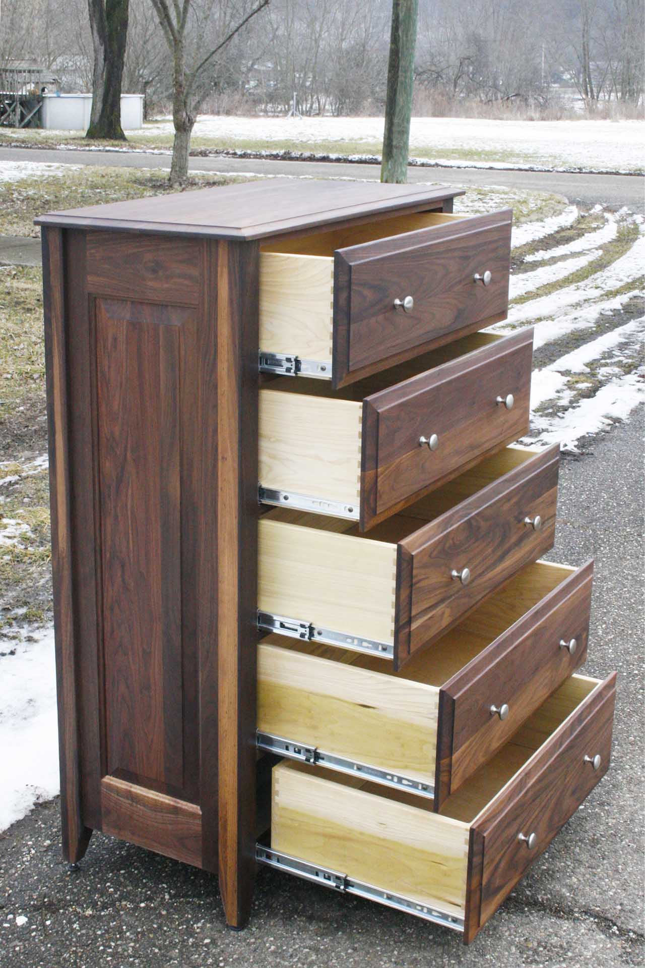 hardwood dresser with 5 open drawers side view