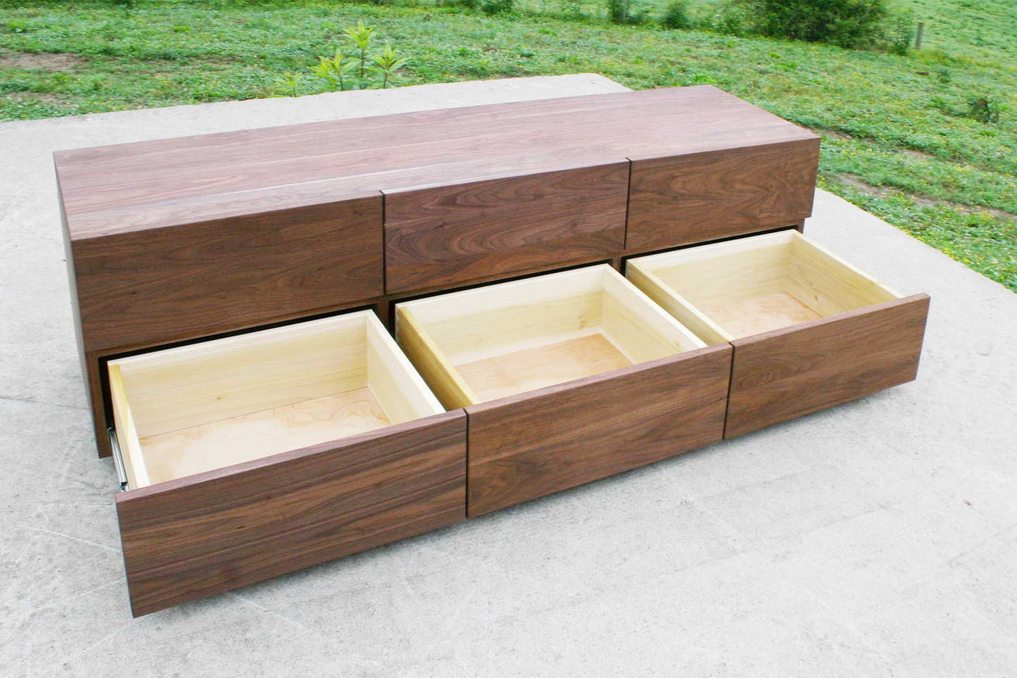 three bottom drawers extended on dresser