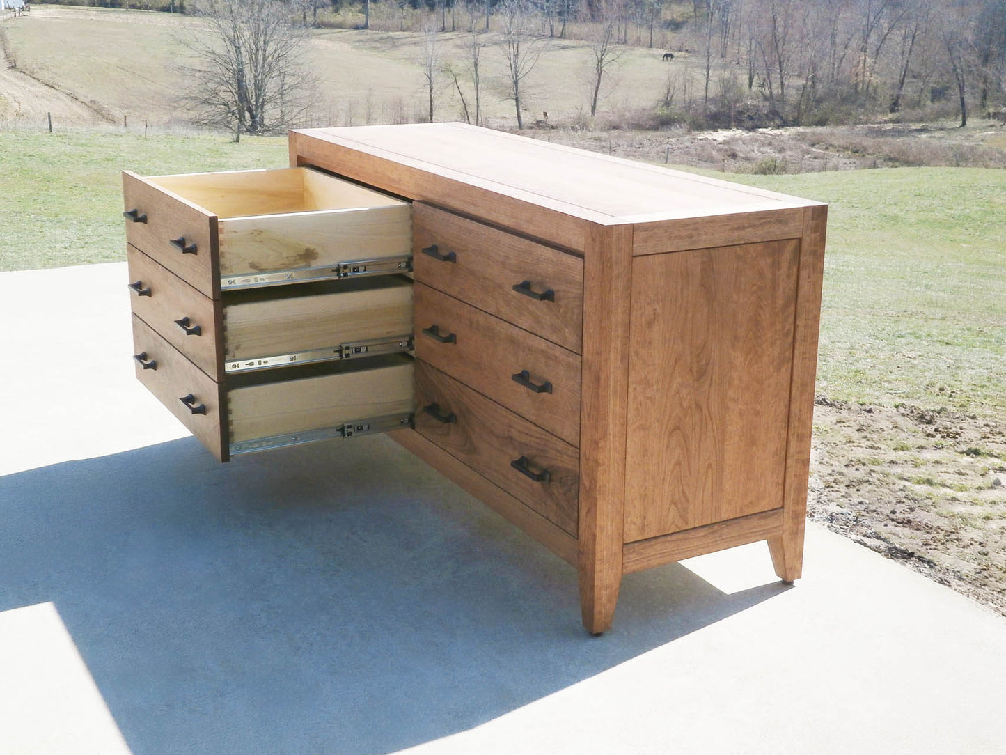dresser with 6 drawers with long pulls natural hardwood and drawers open