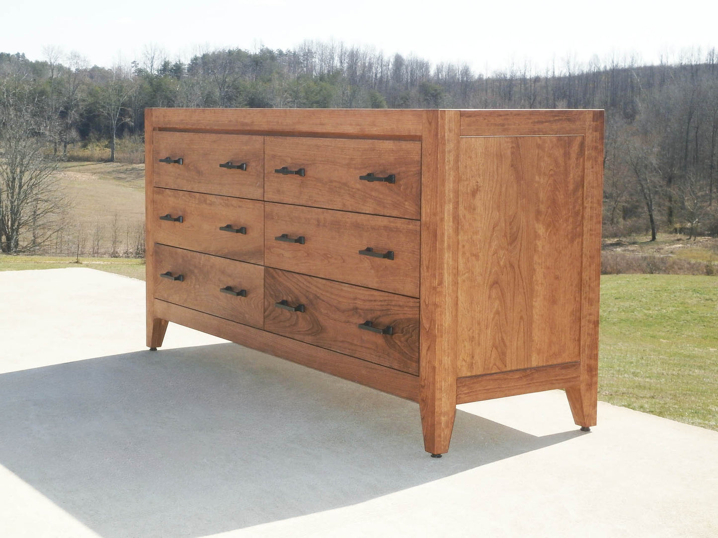 dresser with 6 drawers with long pulls natural hardwood low view
