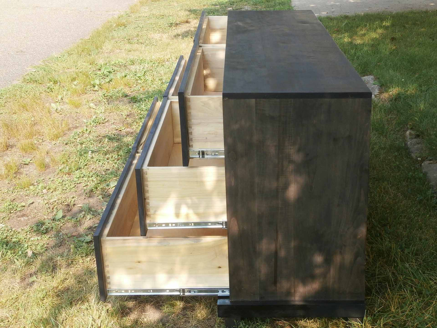side view drawers extended of hardwood dresser American made