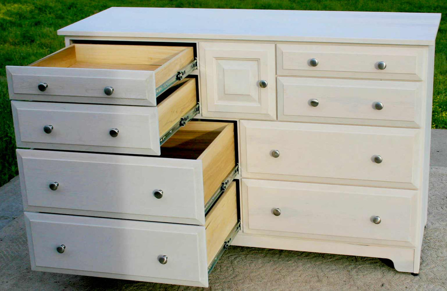 white hardwood dresser with drawers open