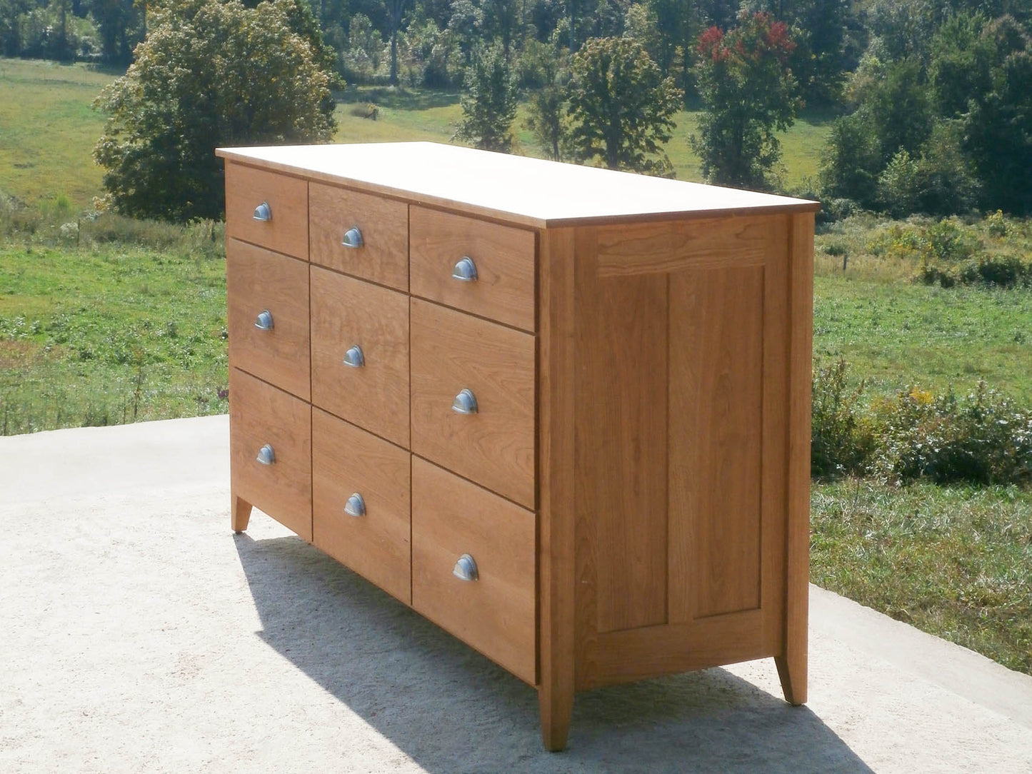 side angled view 9 Drawer Dresser with Flat Paneled Ends and Overlap Drawers