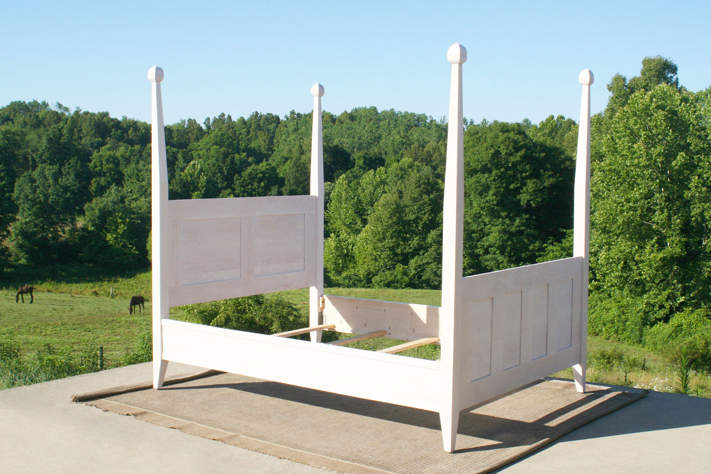 side angled view of Paneled canopy bed with box spring base