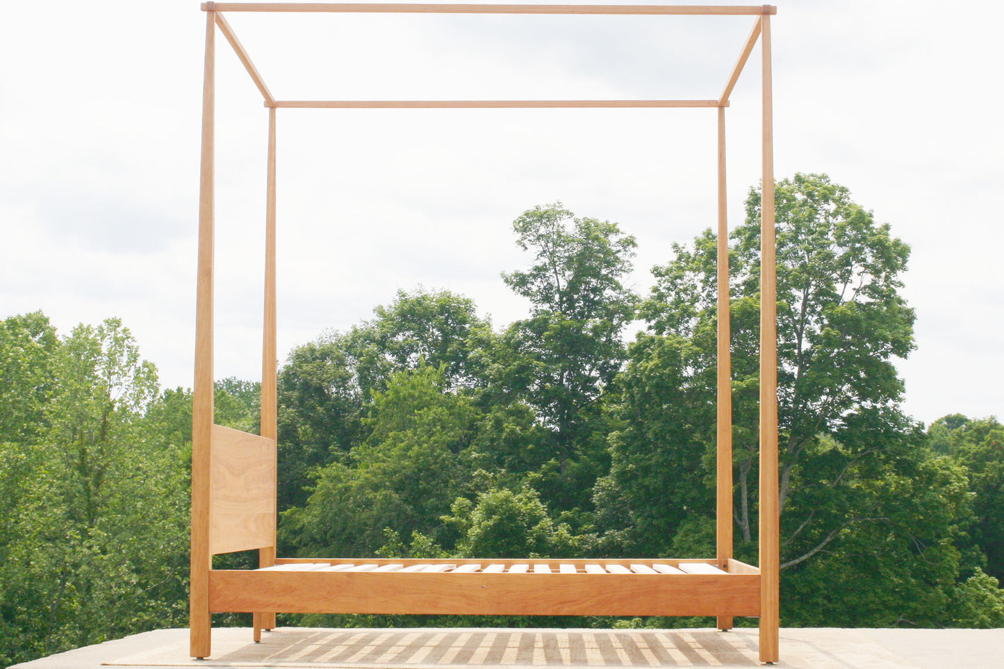 low canopy bed with tapered posts side view