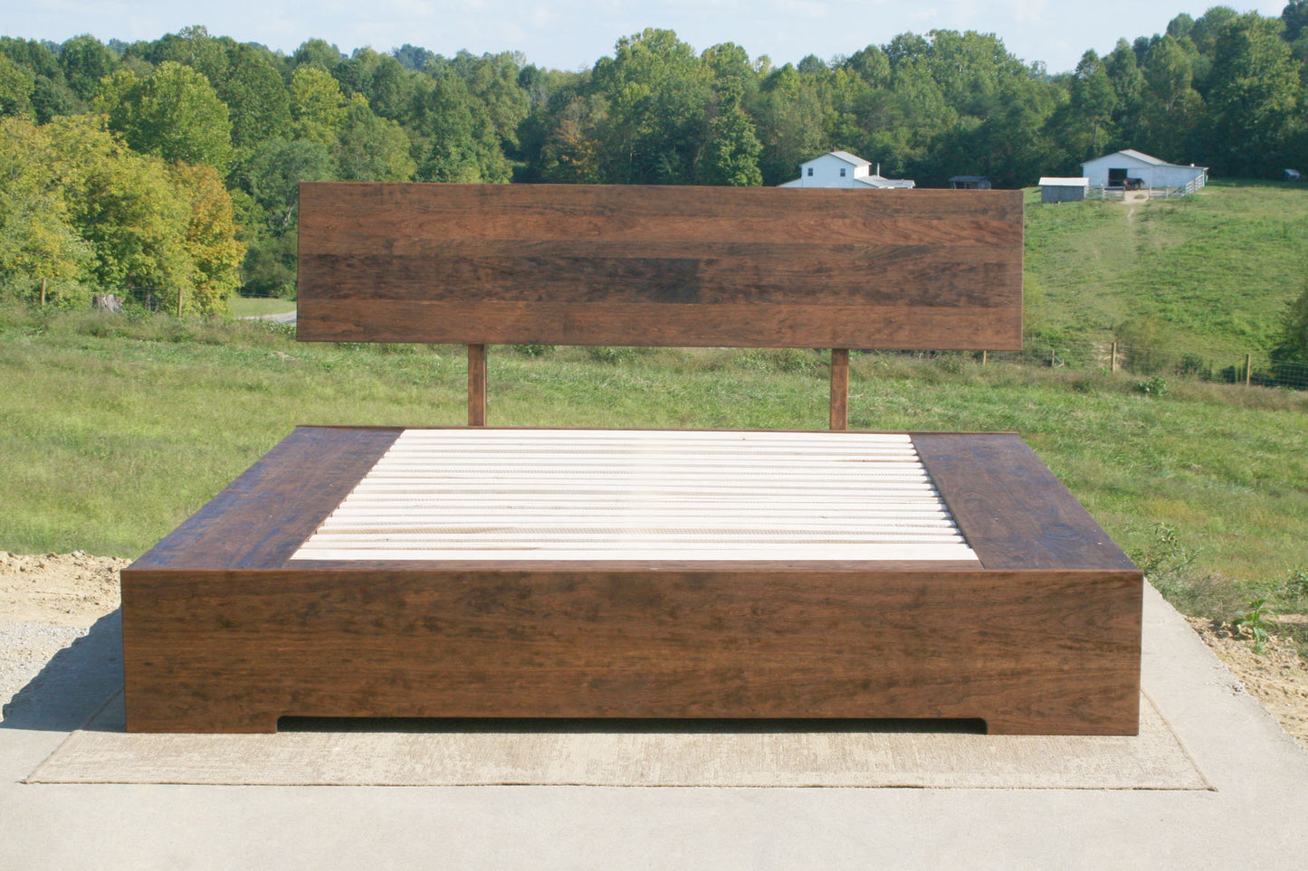 low platform bed with 6 drawers and angled headboard front view