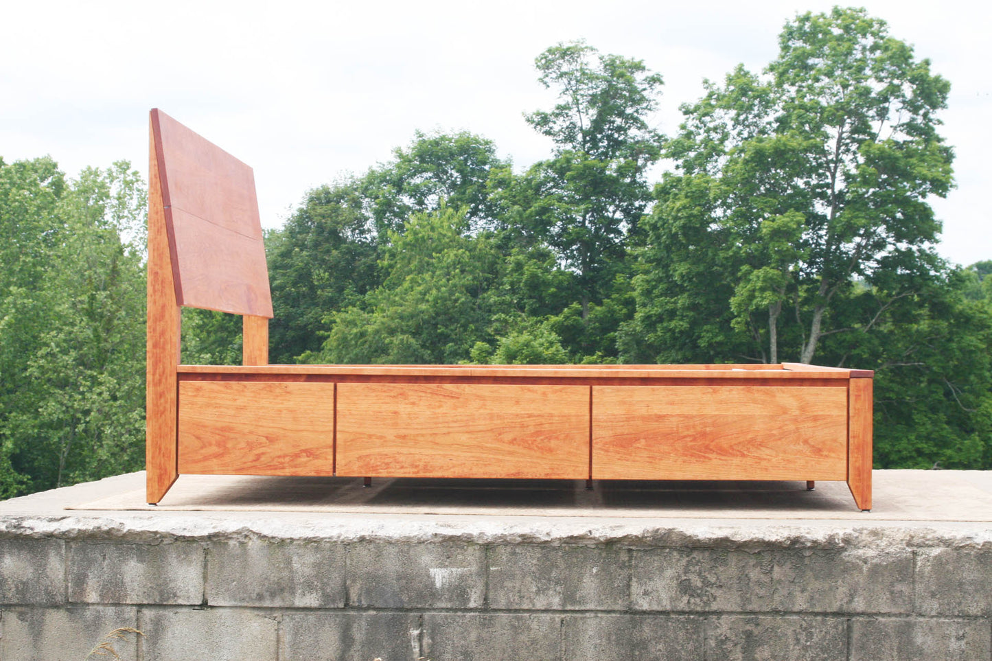 platform storage bed with headboard side view