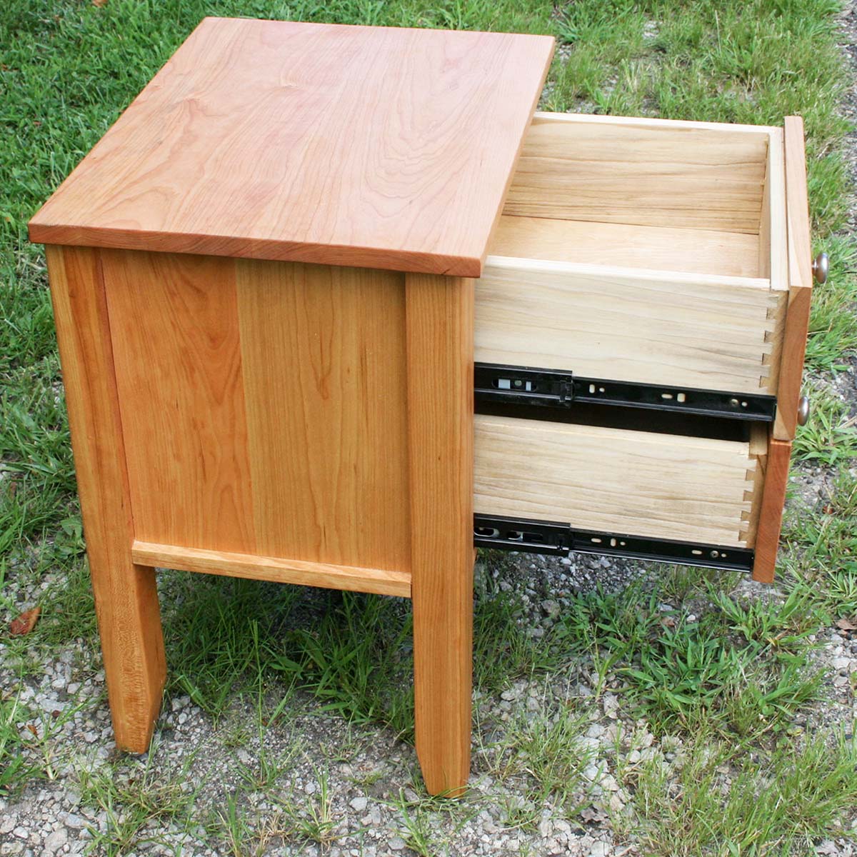 cherry nightstand with drawers open side view