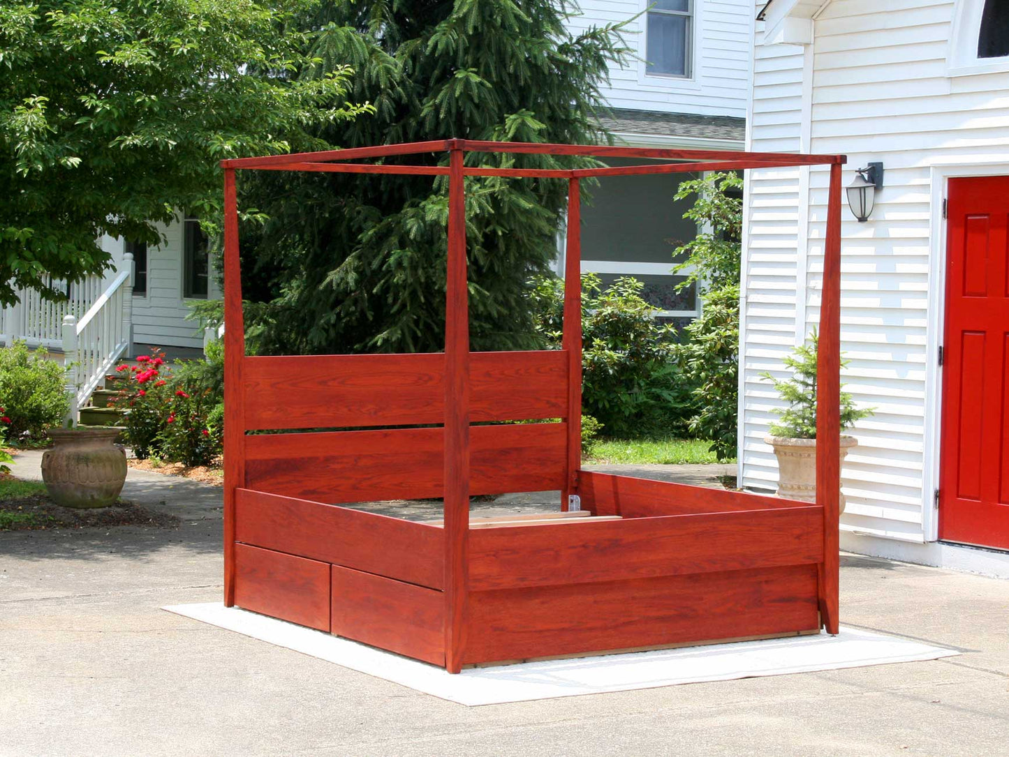 angled view canopy bed with headboard and 4 drawers box spring base