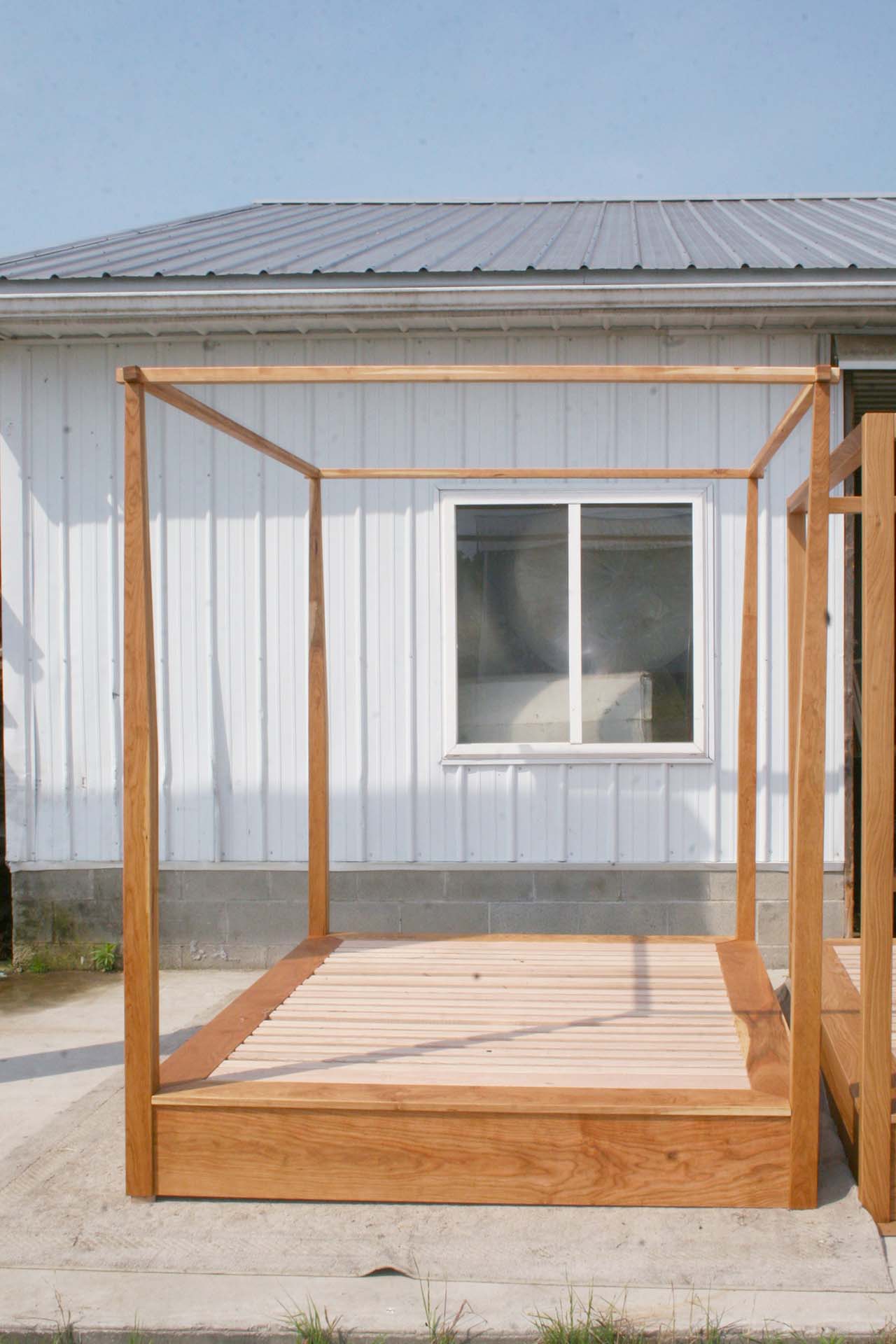 front view canopy bed with low platform large rail canopy and tapered posts