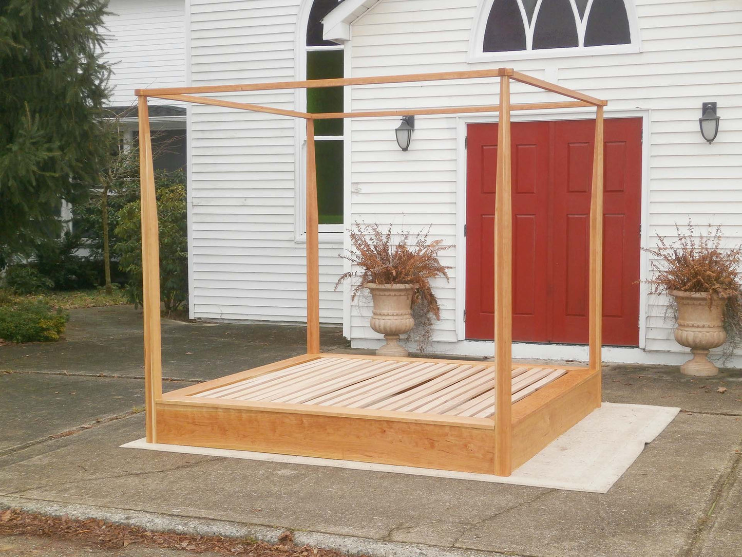 natural Platform Bed with a large rail canopy and tapered posts side view