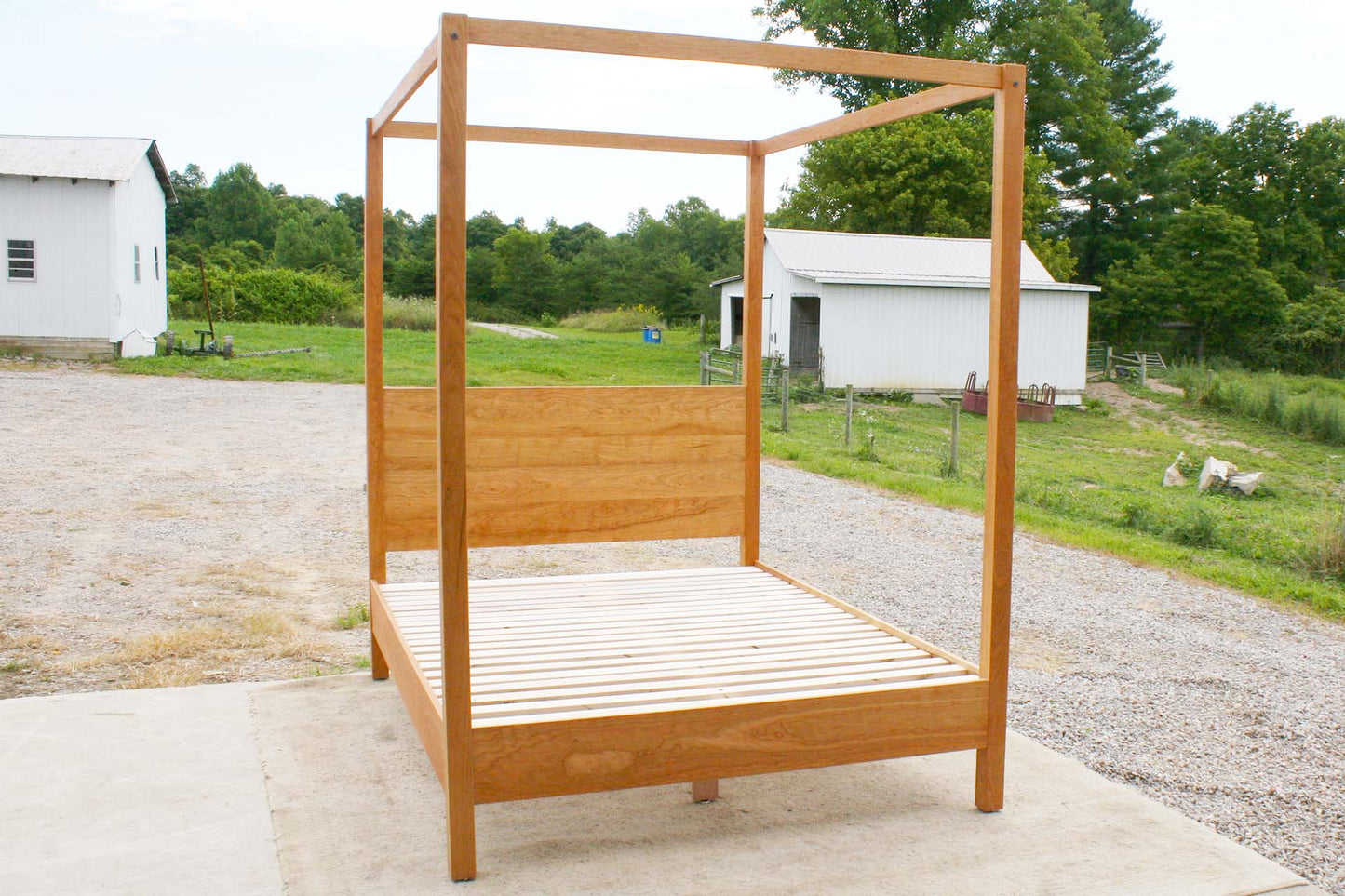 front angled view natural canopy bed with straight posts and top rails