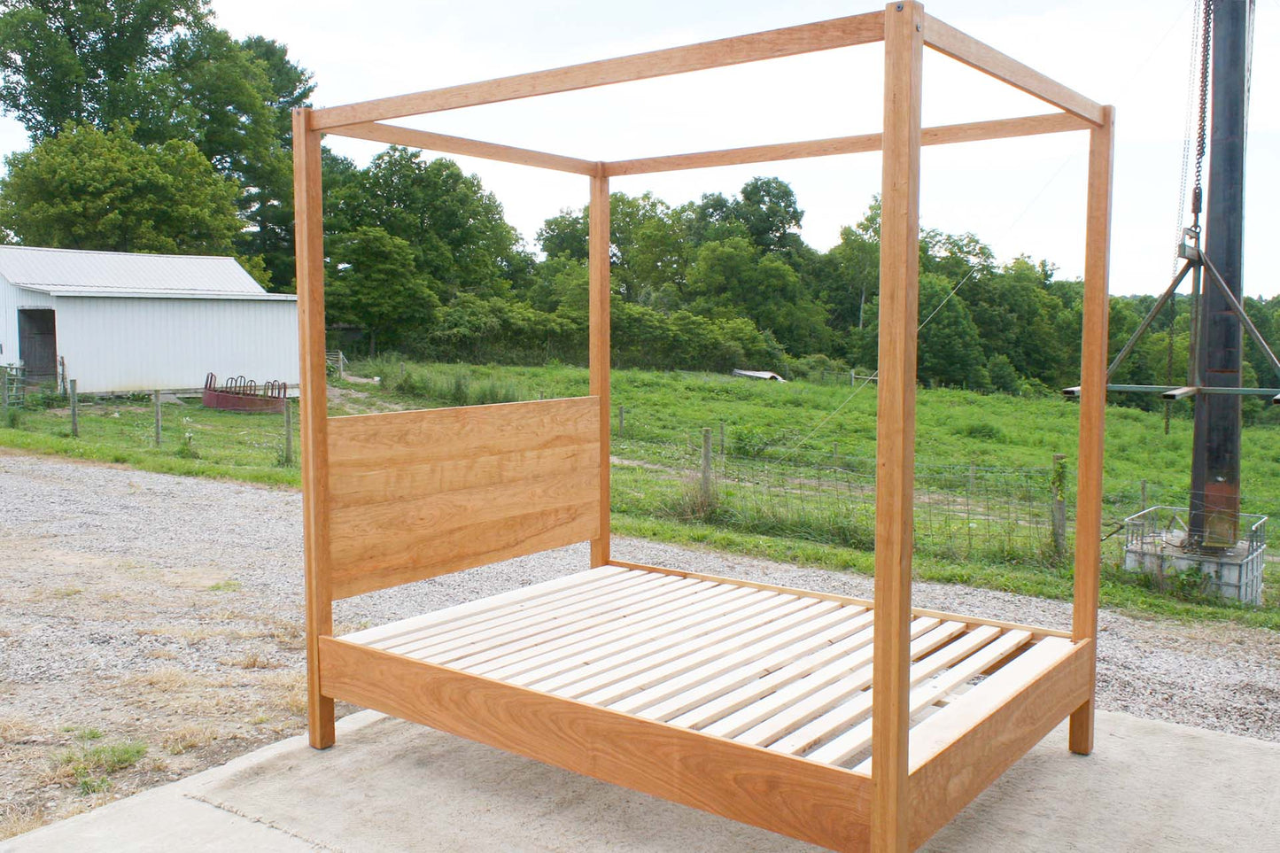 side view natural canopy bed with straight posts and top rails