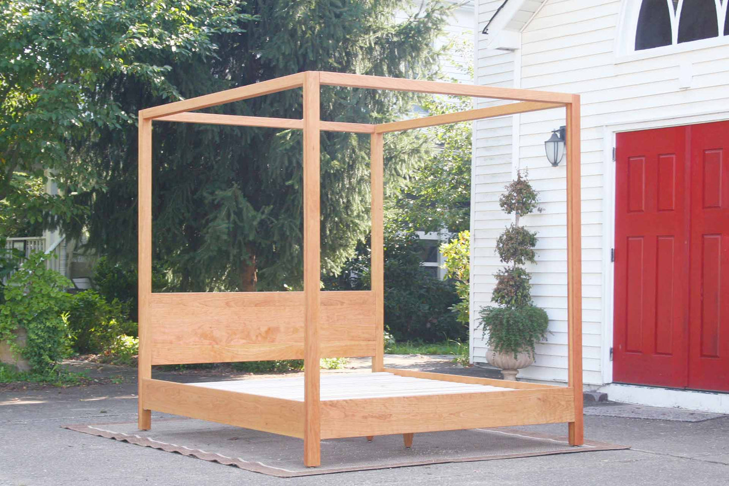 natural canopy bed with straight posts and top rails angled view