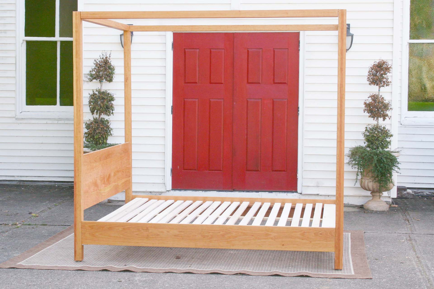 side view natural canopy bed with straight posts and top rails