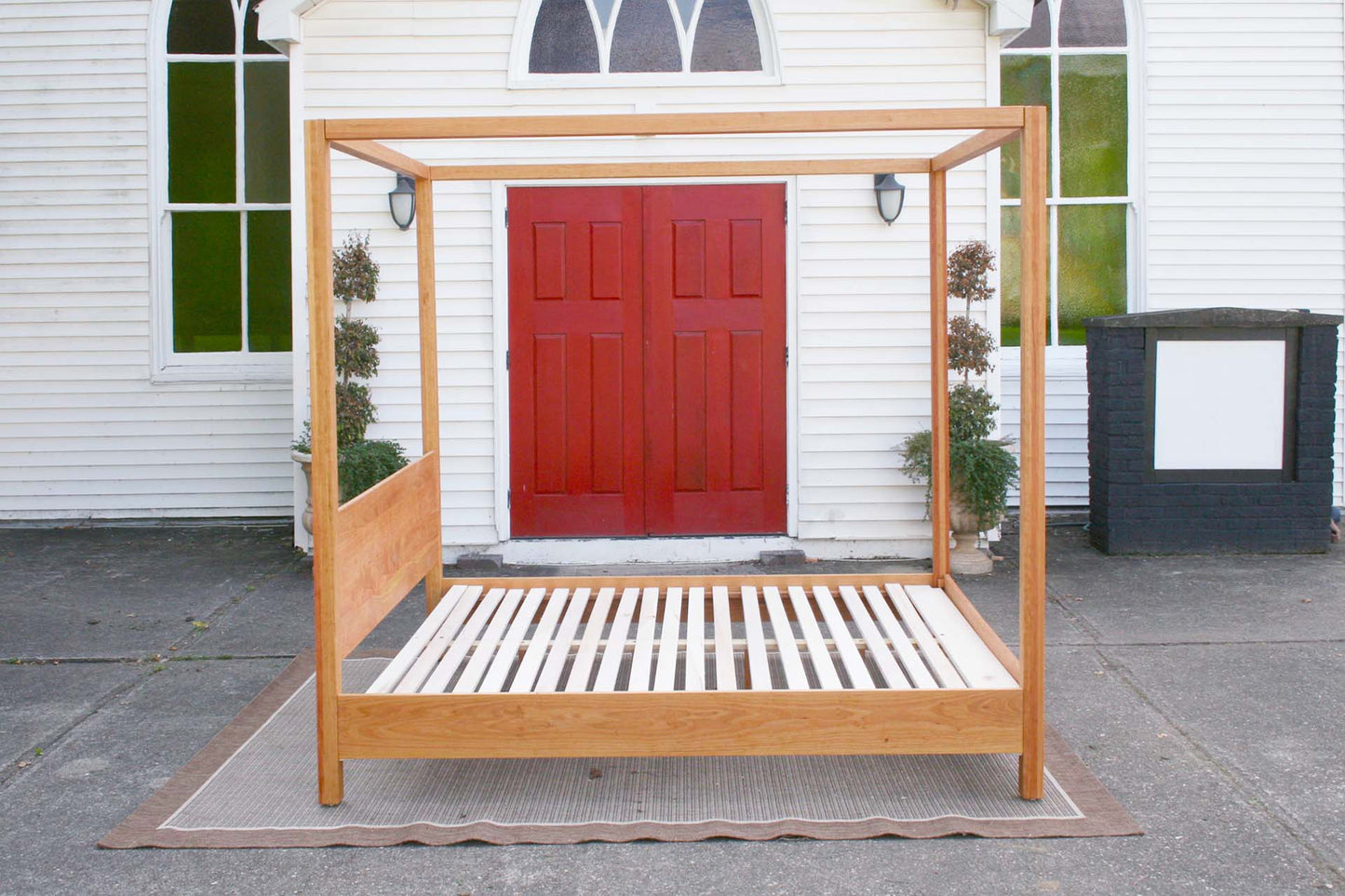 tall side view natural canopy bed with straight posts and top rails