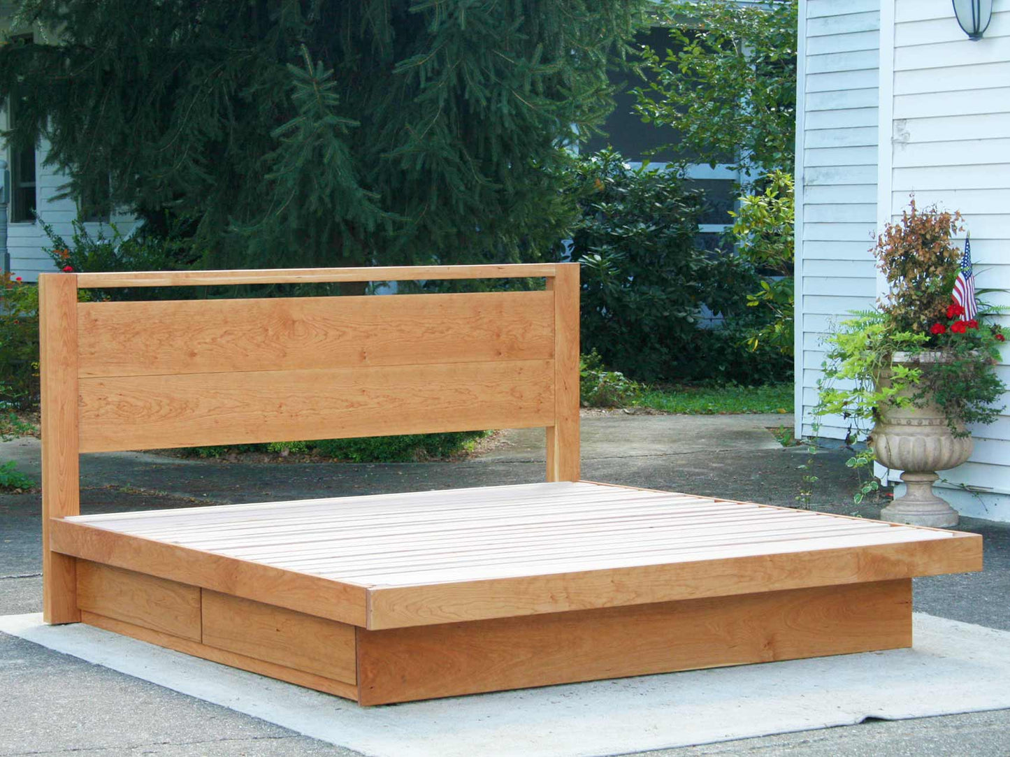 Platform bed with 4 drawers and headboard with top bar