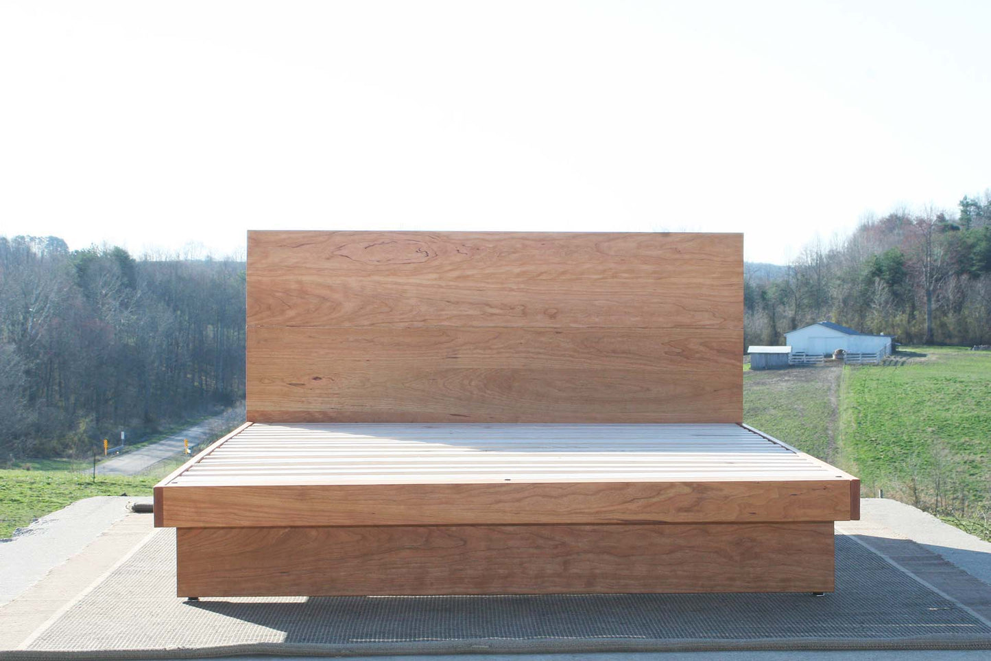 hardwood cantilever platform bed with headboard front view