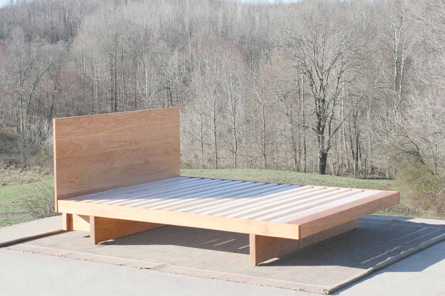 cantilever platform bed with headboard side view Maple