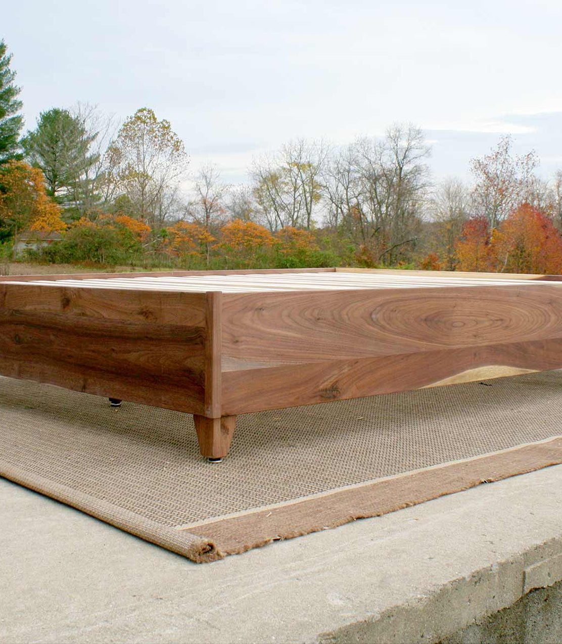 walnut wood bed low view with legs