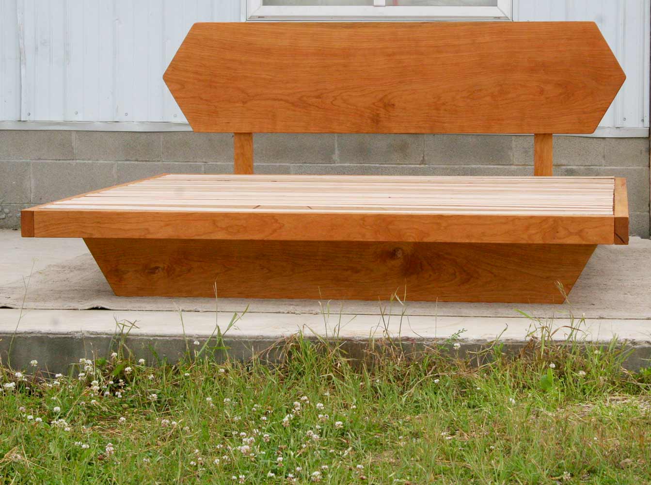 Low Platform Bed with headboard and angled base frame front view