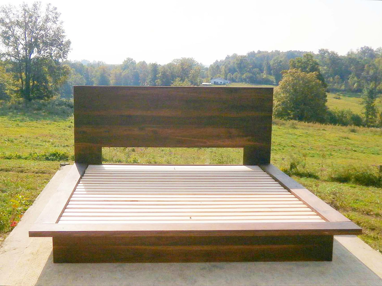 modern platform bed with wide side extensions front view