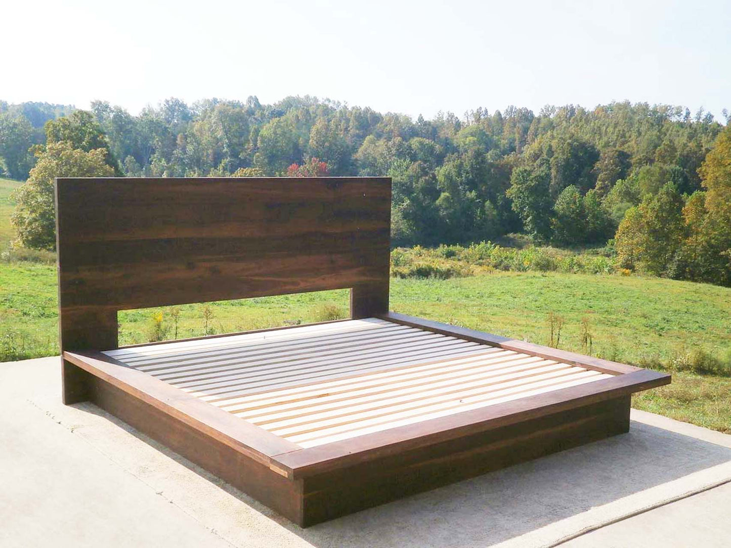Modern platform Bed with headboard and wide side extensions front view