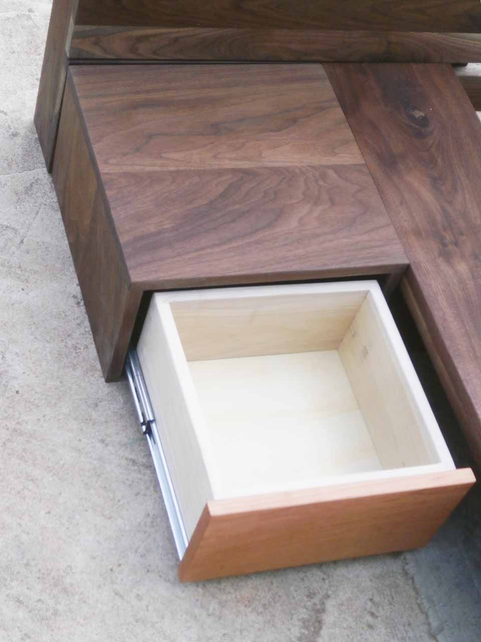 side table of platform bed with drawer extended