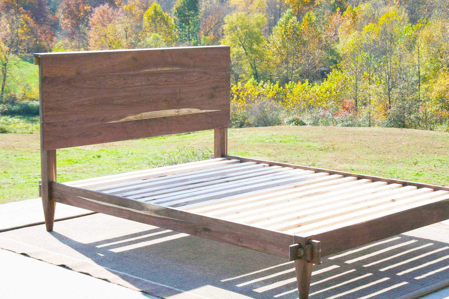close up angled view Raised platform bed with a mortise and tenon system
