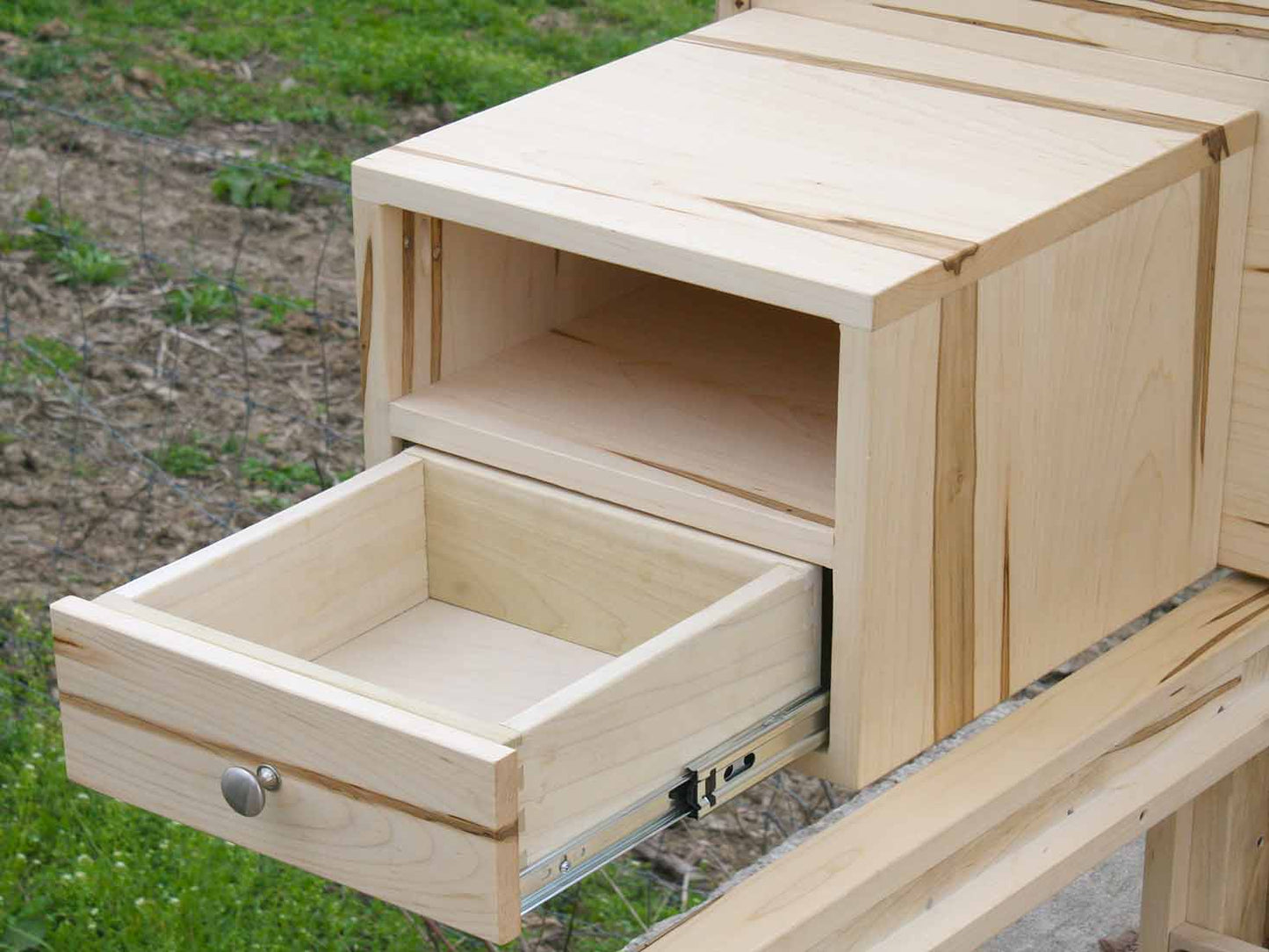 drawer open of Platform Bed with 4 drawers, wide headboard and built-in side tables
